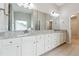 Bathroom featuring double vanity, granite countertops, and spacious cabinets at 4090 Danbury Farms Dr, Cumming, GA 30040