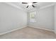 Bedroom with a ceiling fan and a window bringing in natural light at 4090 Danbury Farms Dr, Cumming, GA 30040