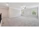 Large bonus room with plush carpeting, neutral walls, ample natural light, and elegant trimwork at 4090 Danbury Farms Dr, Cumming, GA 30040