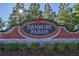 Community sign for Danbury Farms set amongst mature trees and landscaping at 4090 Danbury Farms Dr, Cumming, GA 30040
