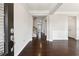Bright entryway featuring hardwood floors, white trim, and a view into the home at 4090 Danbury Farms Dr, Cumming, GA 30040