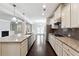 Gourmet kitchen with granite countertops, stainless steel appliances, and custom cabinetry at 4090 Danbury Farms Dr, Cumming, GA 30040