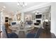 Open concept kitchen and living room featuring stainless steel appliances and breakfast nook at 4090 Danbury Farms Dr, Cumming, GA 30040