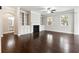 Bright living room features built-in shelving, fireplace, and hardwood floors at 4090 Danbury Farms Dr, Cumming, GA 30040