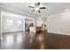 Spacious living area with abundant natural light, hardwood floors, and an open layout at 4090 Danbury Farms Dr, Cumming, GA 30040