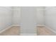 Spacious walk-in closet with carpet and plenty of room for clothing and storage at 4090 Danbury Farms Dr, Cumming, GA 30040
