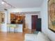 Open living area showcasing a kitchen with bar stools and seating and a comfortable white sofa at 199 14Th Ne St # 1209, Atlanta, GA 30309