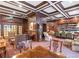 Elegant lounge room featuring wood paneling, bookshelves, tables, chairs, and a grandfather clock at 199 14Th Ne St # 1209, Atlanta, GA 30309