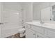 Clean, bright bathroom with a tub/shower combo, white vanity, and modern fixtures at 2182 Talmai Dr, Snellville, GA 30078