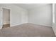 Spacious bedroom with plush carpeting, white walls, and natural light from a double window at 2182 Talmai Dr, Snellville, GA 30078