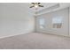 This spacious bedroom has neutral carpet and two bright windows with great natural light at 2182 Talmai Dr, Snellville, GA 30078