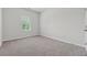 Comfortable bedroom with neutral carpet and a bright window at 2182 Talmai Dr, Snellville, GA 30078