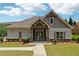 Charming community clubhouse with stone and siding exterior details and manicured lawn at 2182 Talmai Dr, Snellville, GA 30078