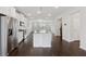 Bright, open kitchen featuring stainless steel appliances, granite countertops, and hardwood floors at 2182 Talmai Dr, Snellville, GA 30078