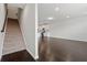 Inviting living space with hardwood floors, stairs, and bright kitchen at 2182 Talmai Dr, Snellville, GA 30078