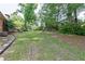 A large backyard with mature trees that create a peaceful and private outdoor space at 2614 Princess Se Ln, Marietta, GA 30067