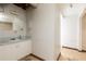 Unfinished basement bathroom with a sink, a toilet, and a mirror at 2614 Princess Se Ln, Marietta, GA 30067