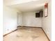 Unfinished basement with an exposed ceiling, wood trim, and a window at 2614 Princess Se Ln, Marietta, GA 30067
