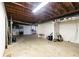 Unfinished basement with exposed beams, concrete floor and white cinder block walls at 2614 Princess Se Ln, Marietta, GA 30067