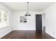 Bright dining room showcasing pristine white walls and gleaming dark hardwood floors at 2614 Princess Se Ln, Marietta, GA 30067