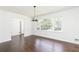 Bright dining room showcasing pristine white walls, gleaming dark hardwood floors and a large window at 2614 Princess Se Ln, Marietta, GA 30067