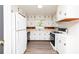 Bright and functional kitchen featuring white cabinetry, modern appliances, and ample counter space at 2614 Princess Se Ln, Marietta, GA 30067