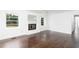 Inviting living room features dark hardwood floors, fireplace, and sunlit windows at 2614 Princess Se Ln, Marietta, GA 30067