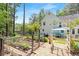 Landscaped backyard featuring a garden and patio area, perfect for entertaining or relaxing at 350 Westchester Way, Canton, GA 30115