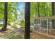 Wooded backyard with outdoor seating and well-kept greenery provides a private retreat at 350 Westchester Way, Canton, GA 30115