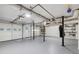 Spacious basement with exposed ductwork, shelving, and a garage door entrance at 350 Westchester Way, Canton, GA 30115