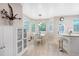 Bright breakfast nook with bay window, white table, and access to a patio, ideal for casual dining at 350 Westchester Way, Canton, GA 30115