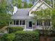 Charming two-story home with a welcoming front porch and lush landscaping at 350 Westchester Way, Canton, GA 30115