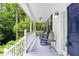 Inviting front porch with rocking chairs and classic design details at 350 Westchester Way, Canton, GA 30115