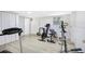 Home gym with exercise equipment, light wood floors, and natural light from the window at 350 Westchester Way, Canton, GA 30115