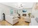 Cozy living room with a fireplace, neutral-toned furniture, hardwood floors, and plenty of natural light at 350 Westchester Way, Canton, GA 30115