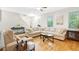Inviting living room with hardwood floors, comfortable seating, and plenty of natural light, creating a relaxing atmosphere at 350 Westchester Way, Canton, GA 30115