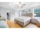 Large main bedroom with wood floors, tray ceiling, and access to ensuite bathroom and closet at 350 Westchester Way, Canton, GA 30115