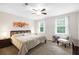 Tranquil primary bedroom with a comfortable queen-sized bed, soft carpeting, and plenty of natural light at 350 Westchester Way, Canton, GA 30115