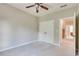 Neutral bedroom featuring a ceiling fan, carpet, and closet with double doors at 3641 Ridge Towne Dr, Duluth, GA 30096