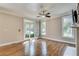Bright bedroom with hardwood floors, ceiling fan and outdoor access at 3641 Ridge Towne Dr, Duluth, GA 30096