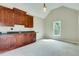 Large bonus room with a kitchenette, natural light, and neutral walls with carpet at 3641 Ridge Towne Dr, Duluth, GA 30096