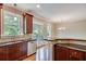 Bright kitchen with granite countertops, stainless appliances, and access to outdoor deck at 3641 Ridge Towne Dr, Duluth, GA 30096