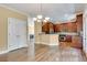 Open-concept kitchen and living space with hardwood floors and stainless steel appliances at 3641 Ridge Towne Dr, Duluth, GA 30096