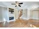 Living room featuring a cozy fireplace and adjacent staircase at 3641 Ridge Towne Dr, Duluth, GA 30096