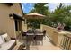 Inviting outdoor patio with seating, dining table, and shade umbrella at 3641 Ridge Towne Dr, Duluth, GA 30096
