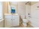 Bathroom with a white vanity, toilet, and shower-tub combo with tile flooring at 4358 Grove Field Ct, Suwanee, GA 30024