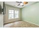 Neutral bedroom with carpet, two windows and a ceiling fan at 4358 Grove Field Ct, Suwanee, GA 30024