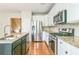 Kitchen featuring stainless steel appliances, granite counters and a spacious island at 4358 Grove Field Ct, Suwanee, GA 30024