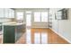 Open kitchen with hardwood floors and island at 4358 Grove Field Ct, Suwanee, GA 30024
