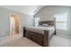 Large bedroom features a statement bed, high ceilings, and neutral walls, creating a calming atmosphere at 1031 High Tide Ct, Loganville, GA 30052